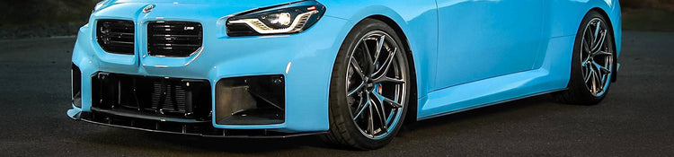 Blue BMW M2 car on a dark background