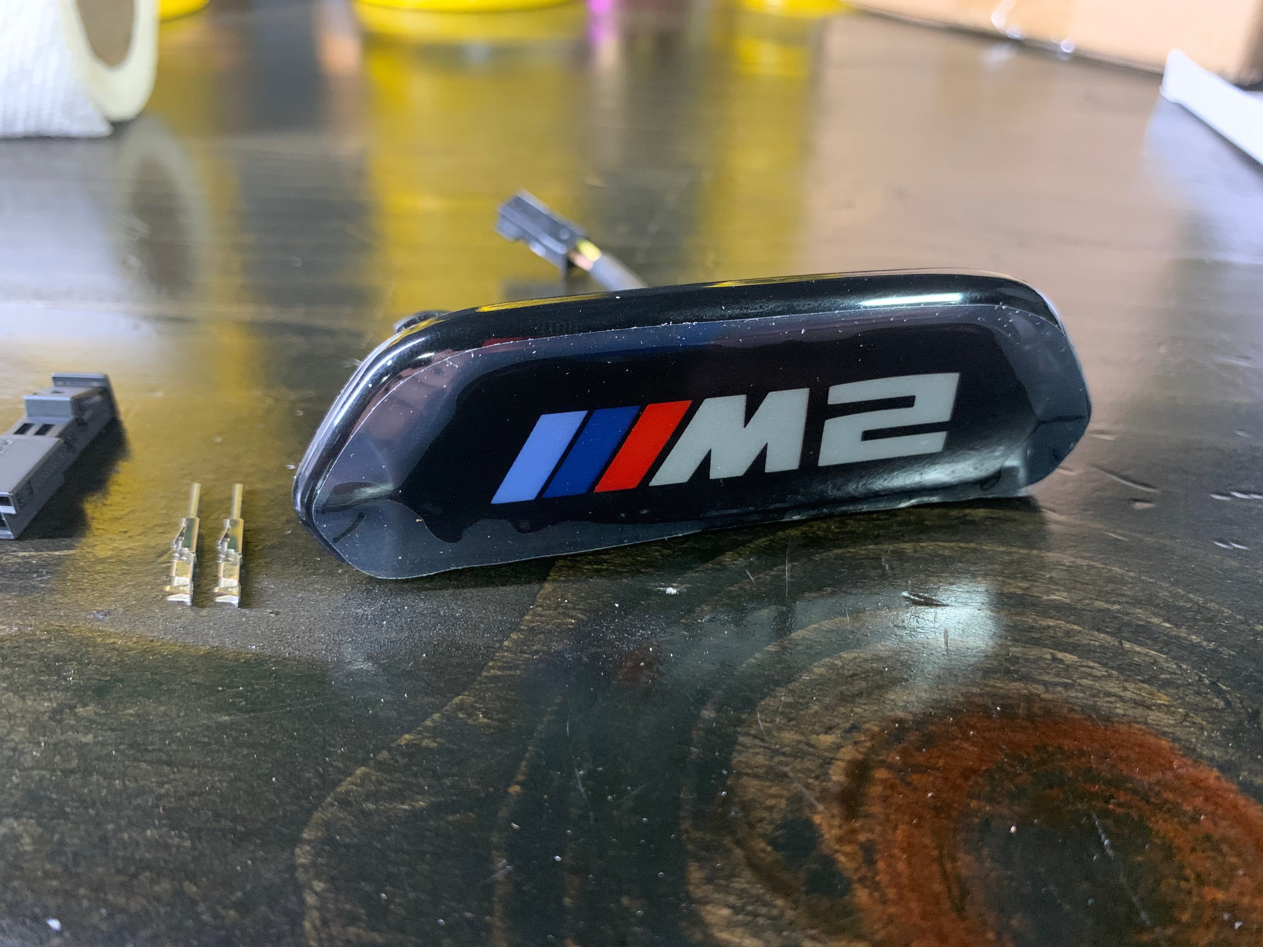 Kies-Motorsports BMW Genuine BMW Illuminated F87 M2 C Backrest Trim Emblem Main image