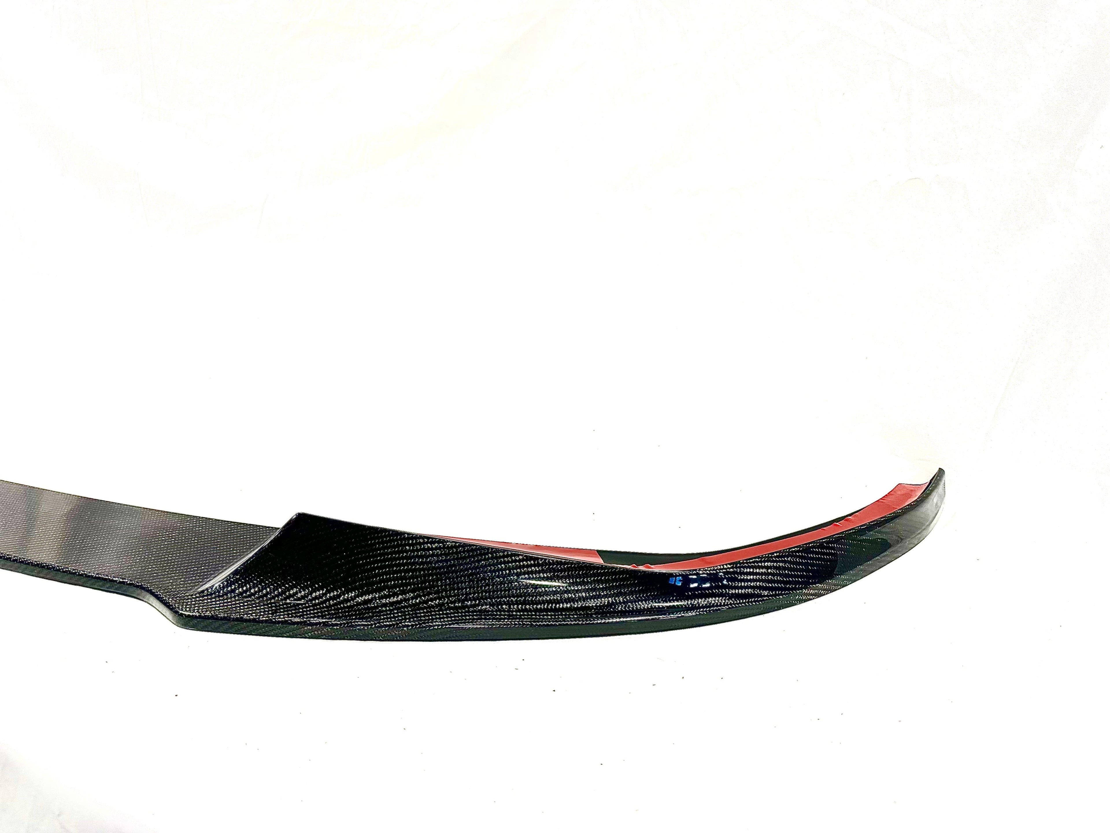 Kies Motorsports — low front angle of G20 3 Series showing the carbon fiber performance front lip's ground clearance and aggressive stance