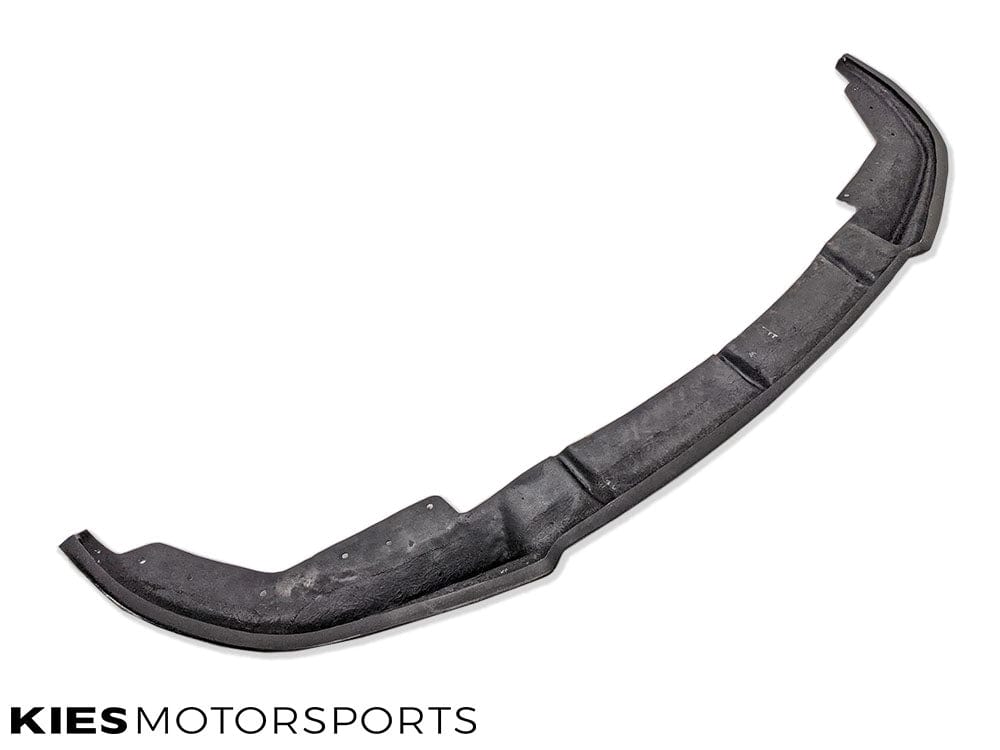 Kies Motorsports — low-angle front view of VSX carbon fiber lip on BMW G20, emphasizing the aggressive splitter overhang and carbon weave