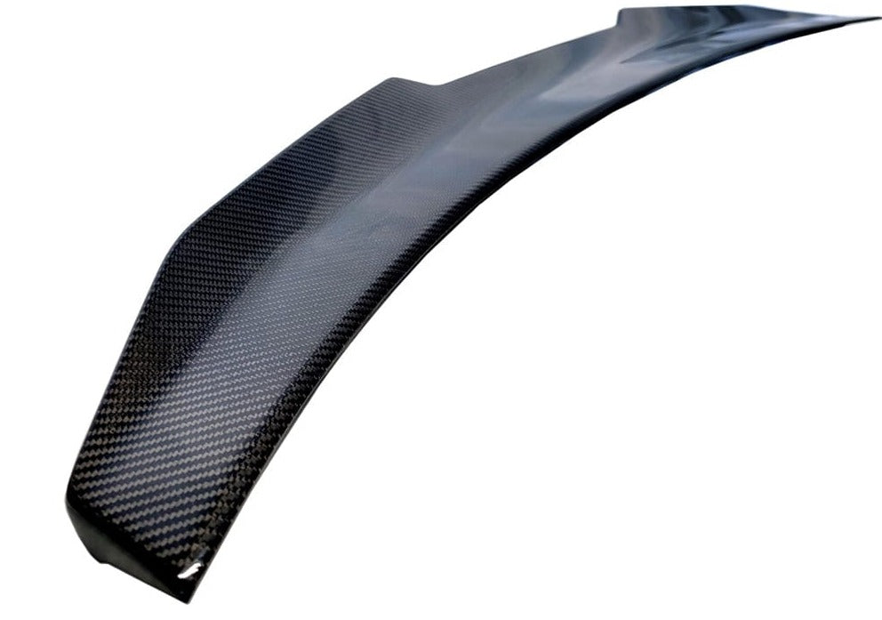 Kies Motorsports — top-down view of PSM high kick carbon trunk spoiler on BMW G22 4 Series, highlighting the spoiler's width and carbon finish