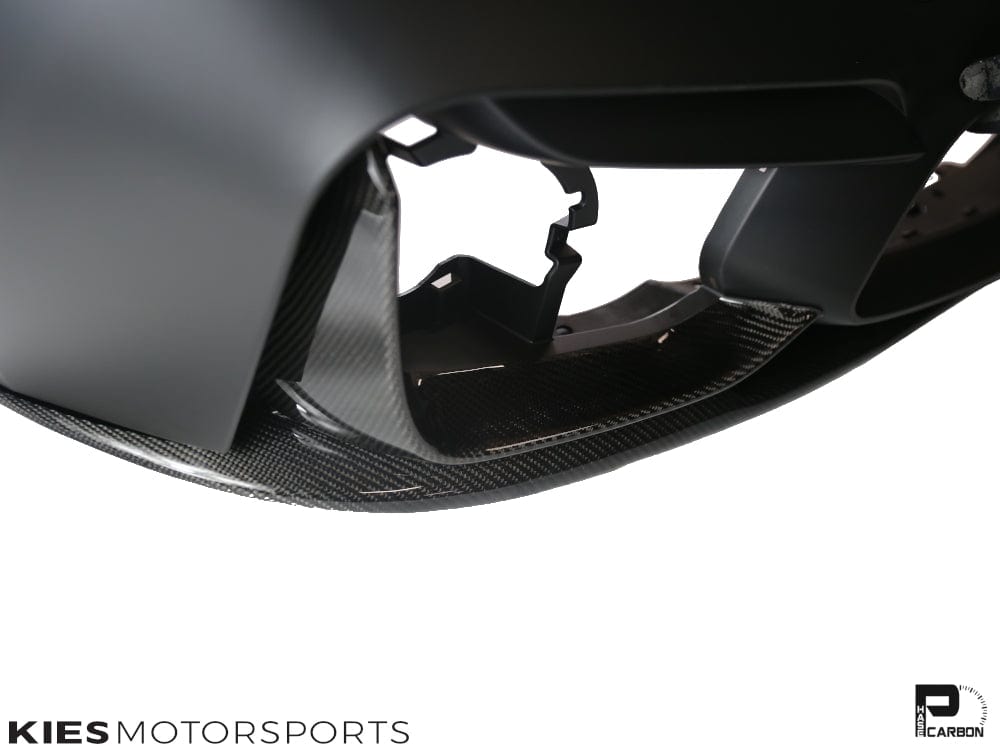 Kies Motorsports — BMW F30 with M3 conversion bumper and carbon fiber front lip, front three-quarter angle highlighting the lip's width and profile