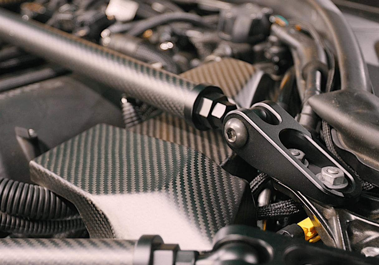 Kies Motorsports — installed on-vehicle shot of BMW G8X Matte Dry Carbon Engine Bay Kit for the M2 / M3 / M4