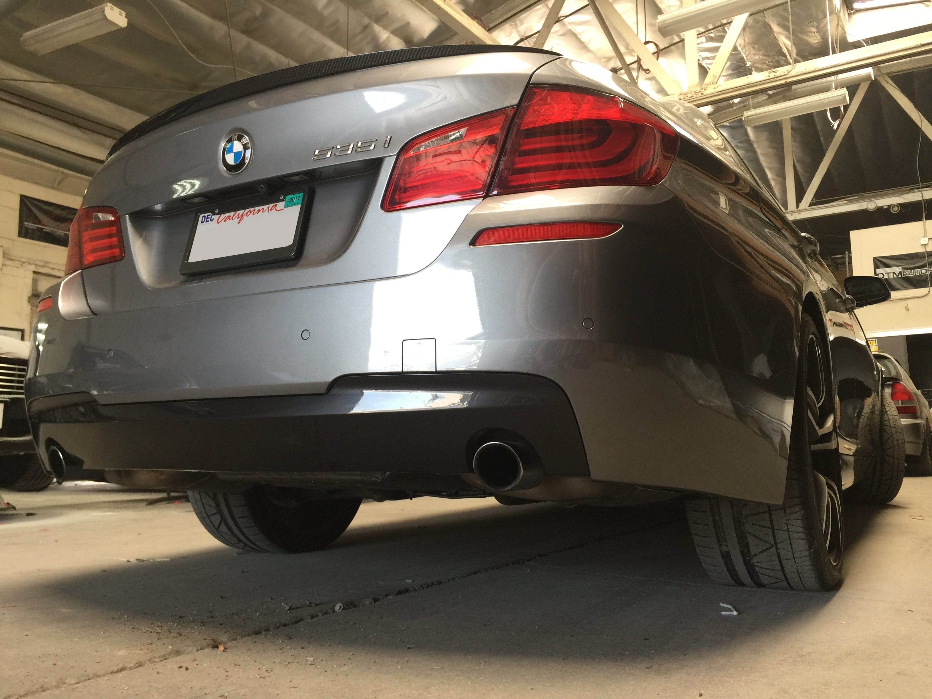 Kies Motorsports — close-up detail of 2011-2016 BMW 5 Series (F10) M Sport Style Rear Bumper Conversion