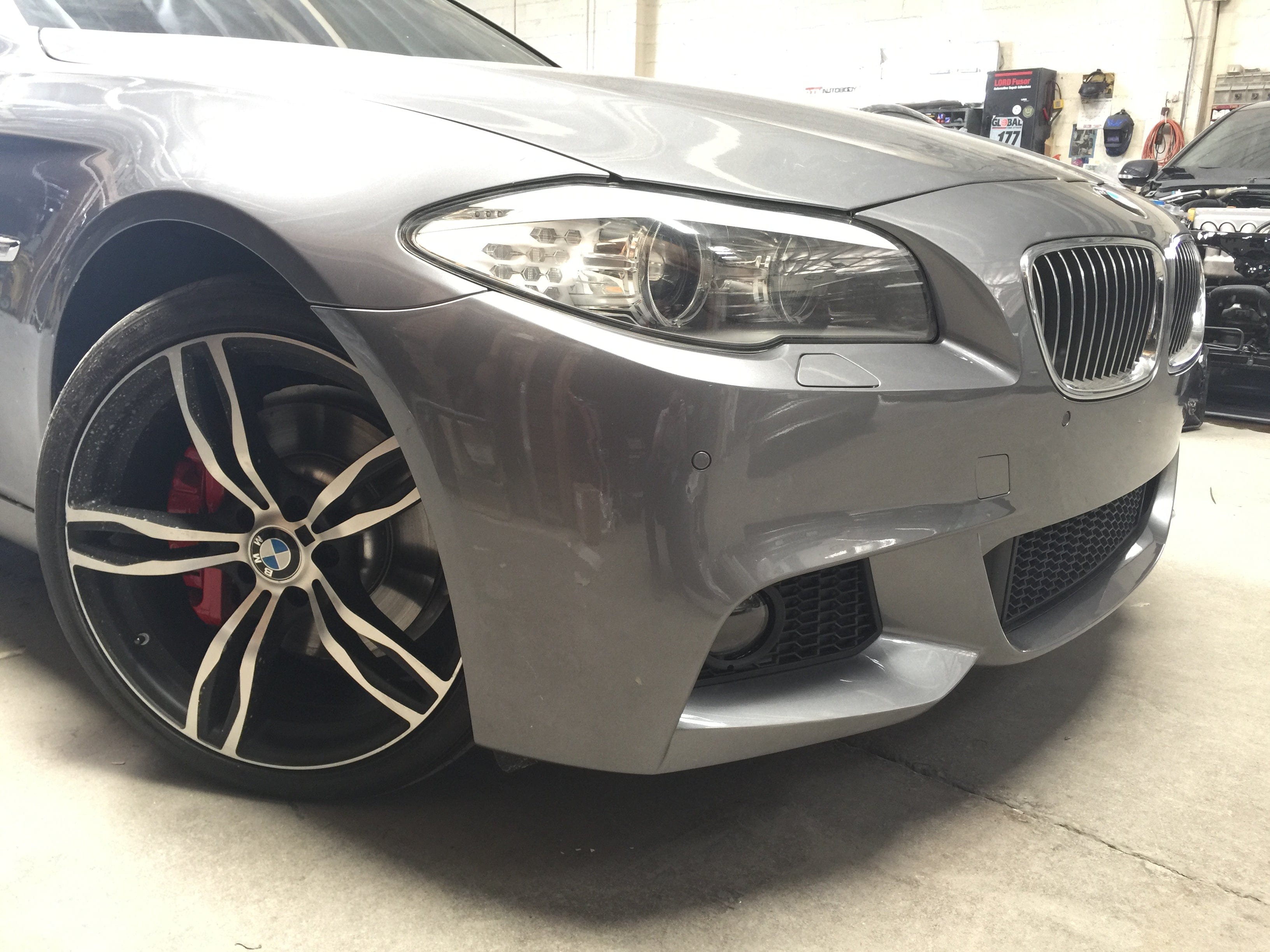 Kies Motorsports — rear angle view of 2011-2013 BMW 5 Series (F10) M Sport Style Front Bumper Conversion Pre-LCI