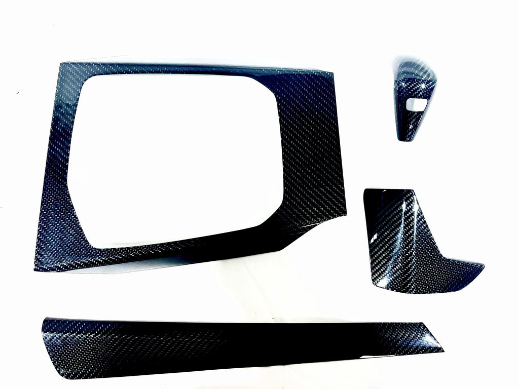 Kies Motorsports — BMW G20 carbon fiber interior trim overlay kit, front angle showing aggressive styling, G20