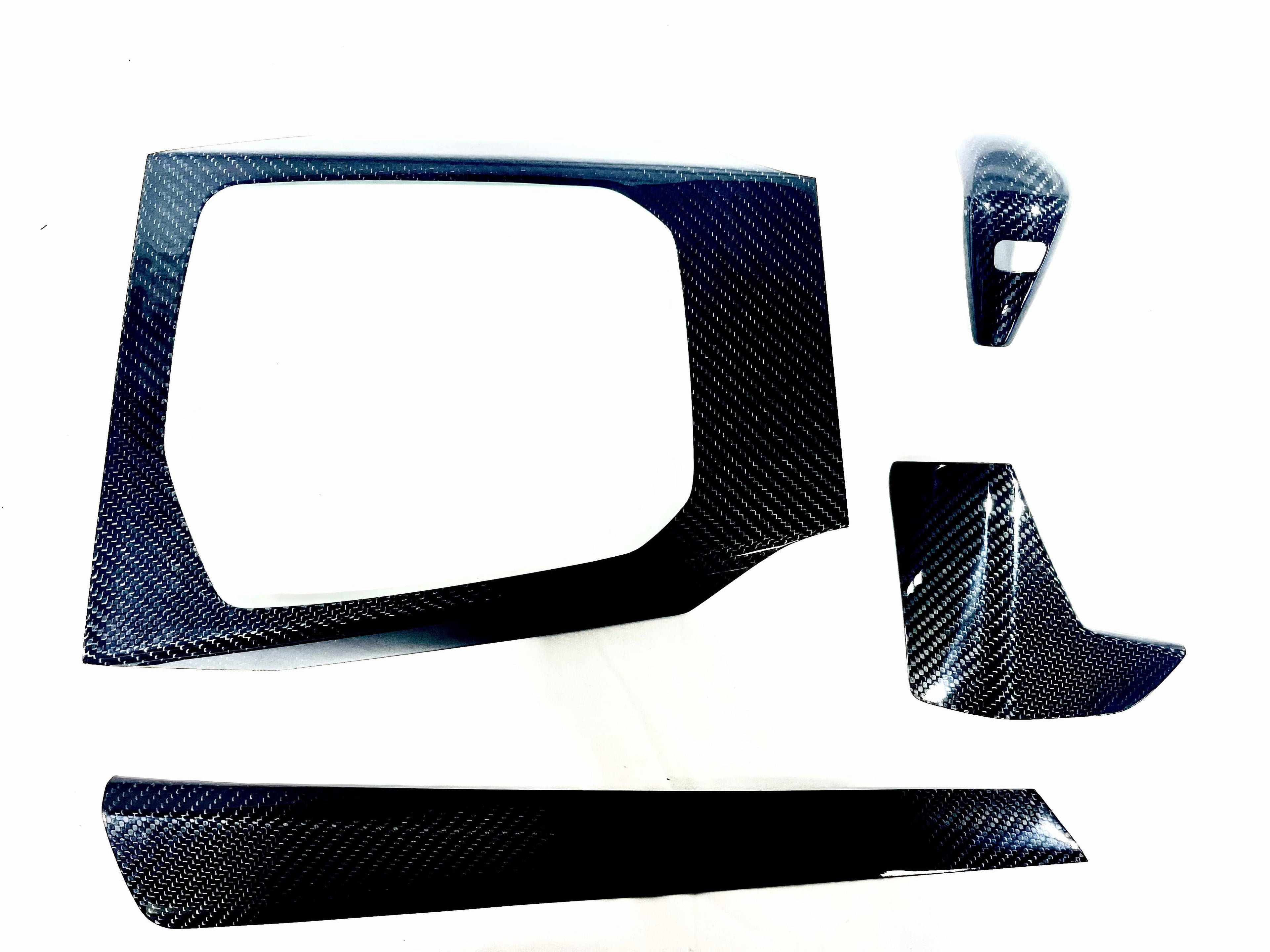 Kies Motorsports — BMW G20 carbon fiber interior trim overlay kit, front angle showing aggressive styling, G20