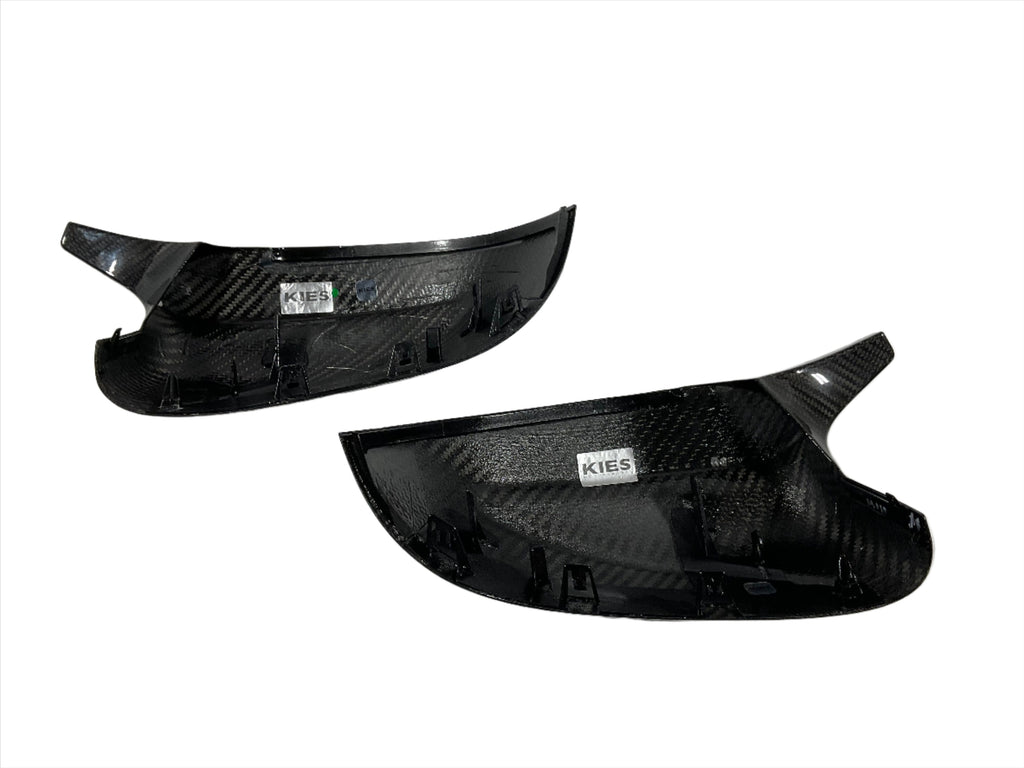 Kies Motorsports — BMW G01 G02 G05 G06 G07 dry carbon fiber mirror cover, installed on vehicle, rear three-quarter view, G01 G02 G05 G06 G07