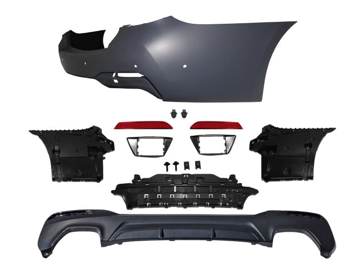 Kies Motorsports — BMW G30 rear bumper conversion, installed on vehicle, rear three-quarter view, G30