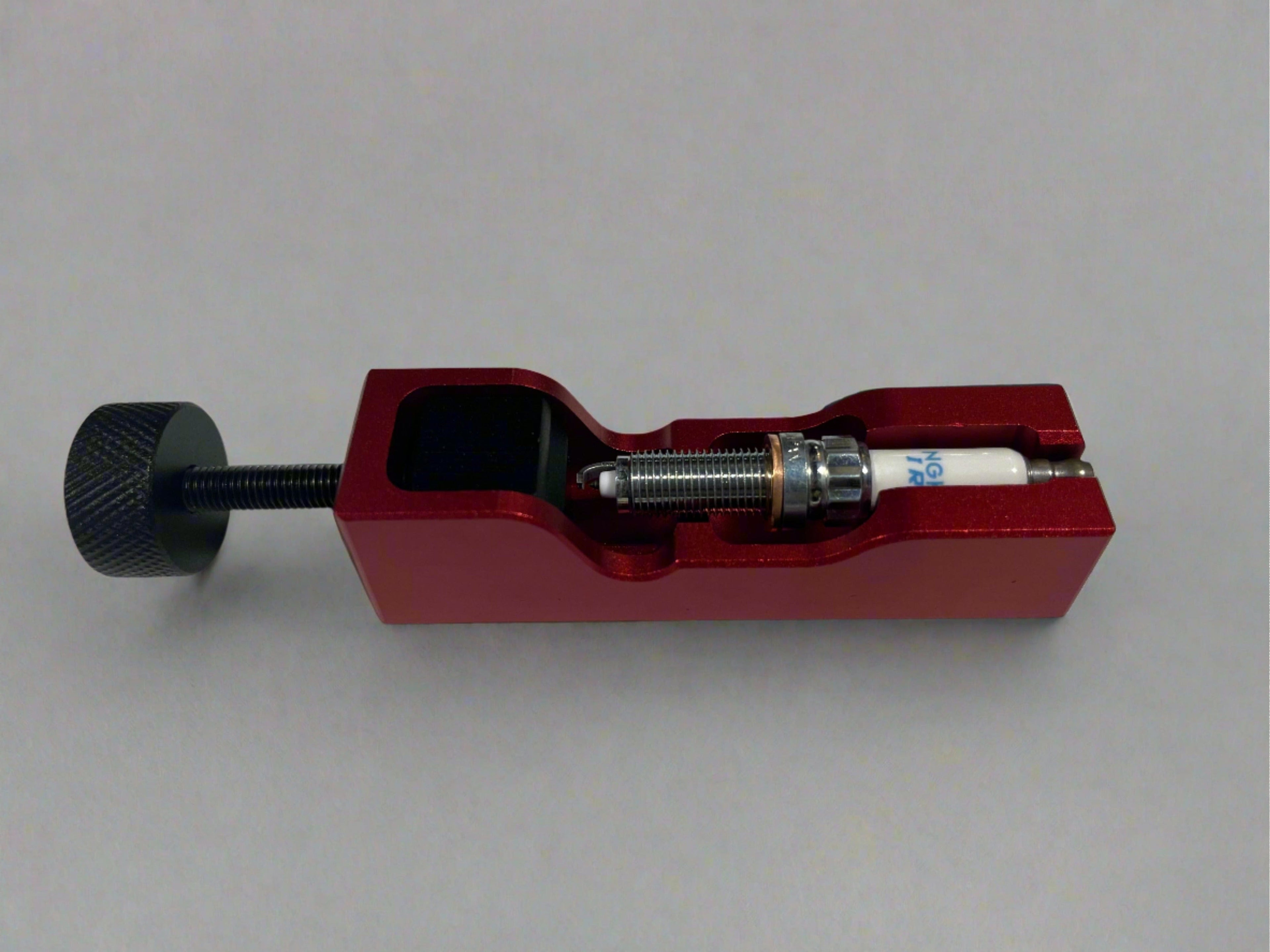 Kies Motorsports — Kies gap tool in use adjusting NGK spark plug gap on BMW performance plug