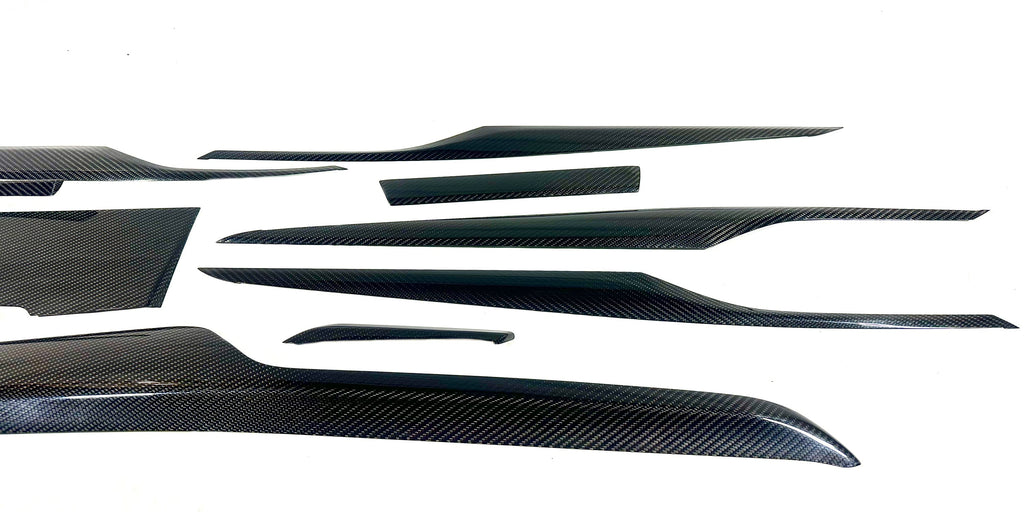 Kies Motorsports — Kies G30 dry carbon dash trim piece close-up showing genuine carbon weave and gloss