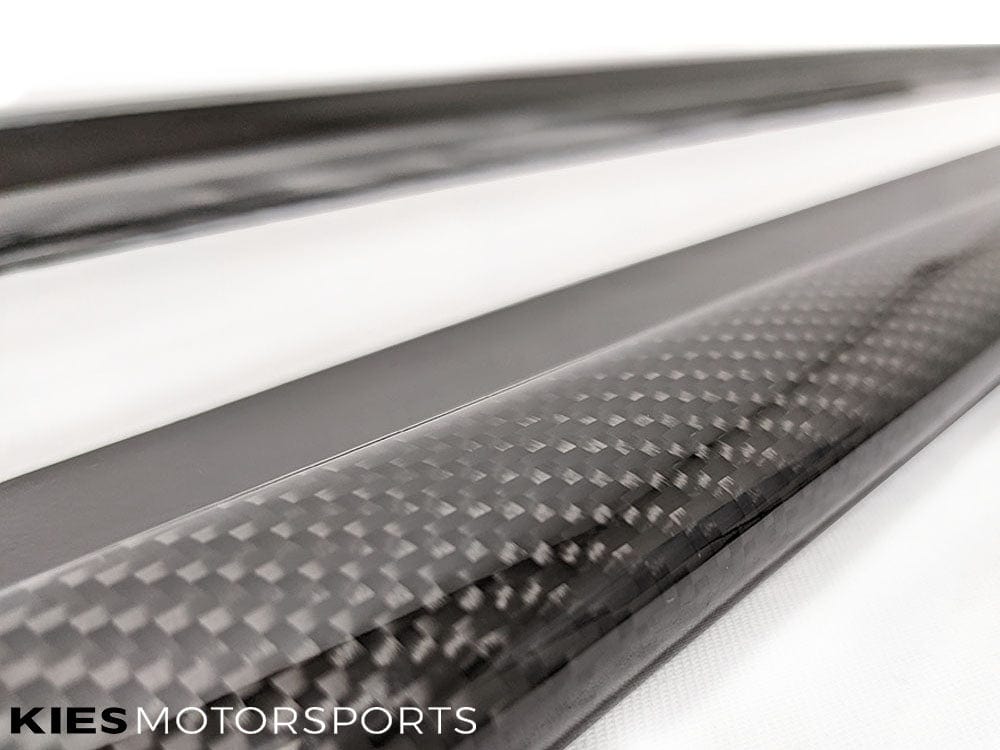 Kies Motorsports — BMW F32 4 Series with 3D carbon fiber side skirt extensions installed, low angle front-quarter view emphasizing ground-hugging stance