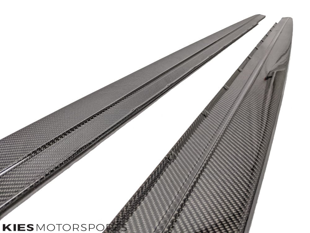Kies Motorsports — close-up detail of carbon fiber weave and mounting edge on G30 performance side skirt extension, quality finish visible