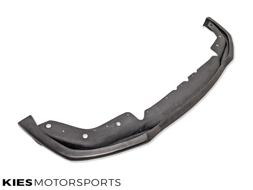 Kies Motorsports — underside view of E-Type carbon fiber front lip on BMW G20, showing mounting points and structural design