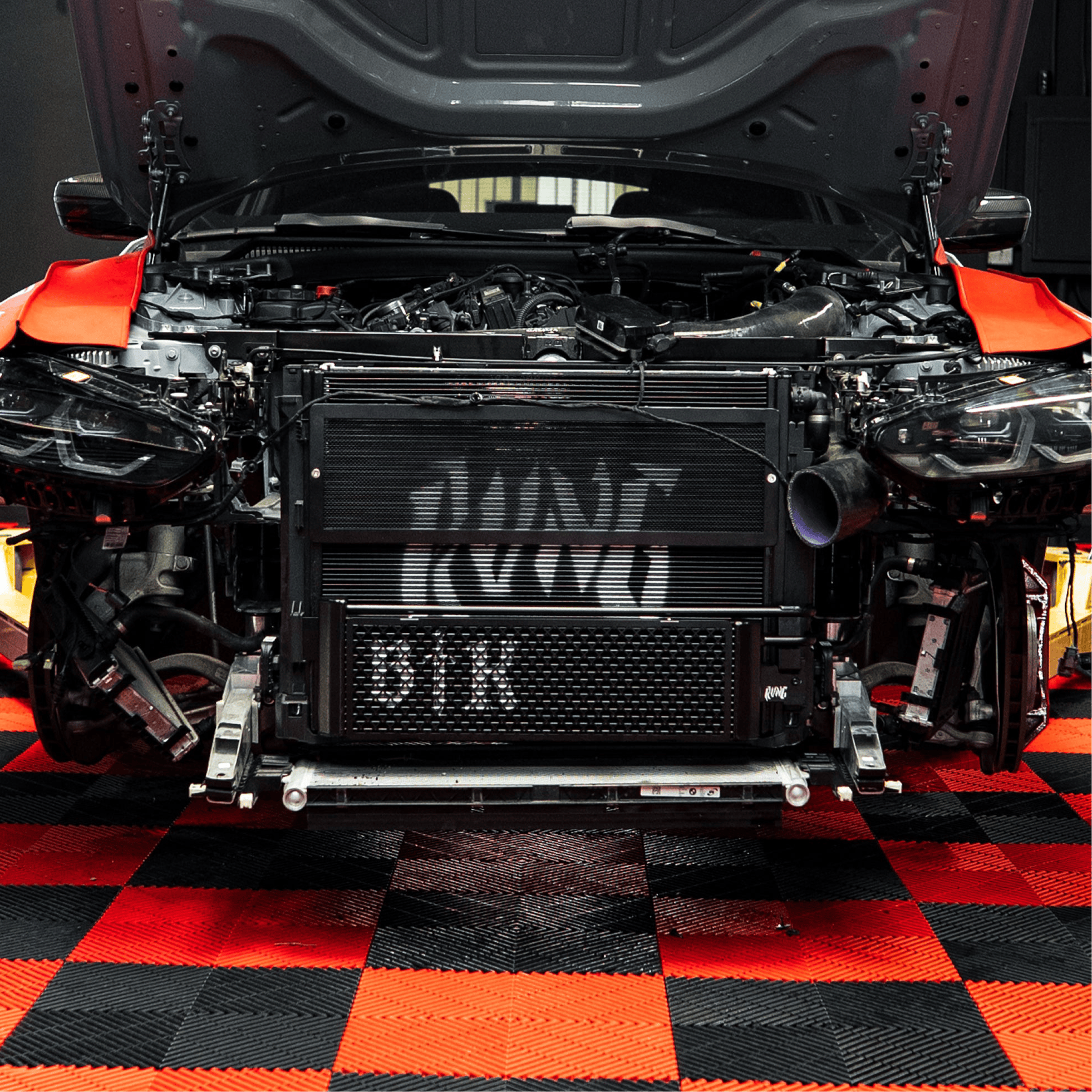 Kies-Motorsports Rvng RaceWorks Rvng (G80,G82,G87) S58 Upgraded Core Transmission Oil Cooler w/ Built in Rock Guard Main image