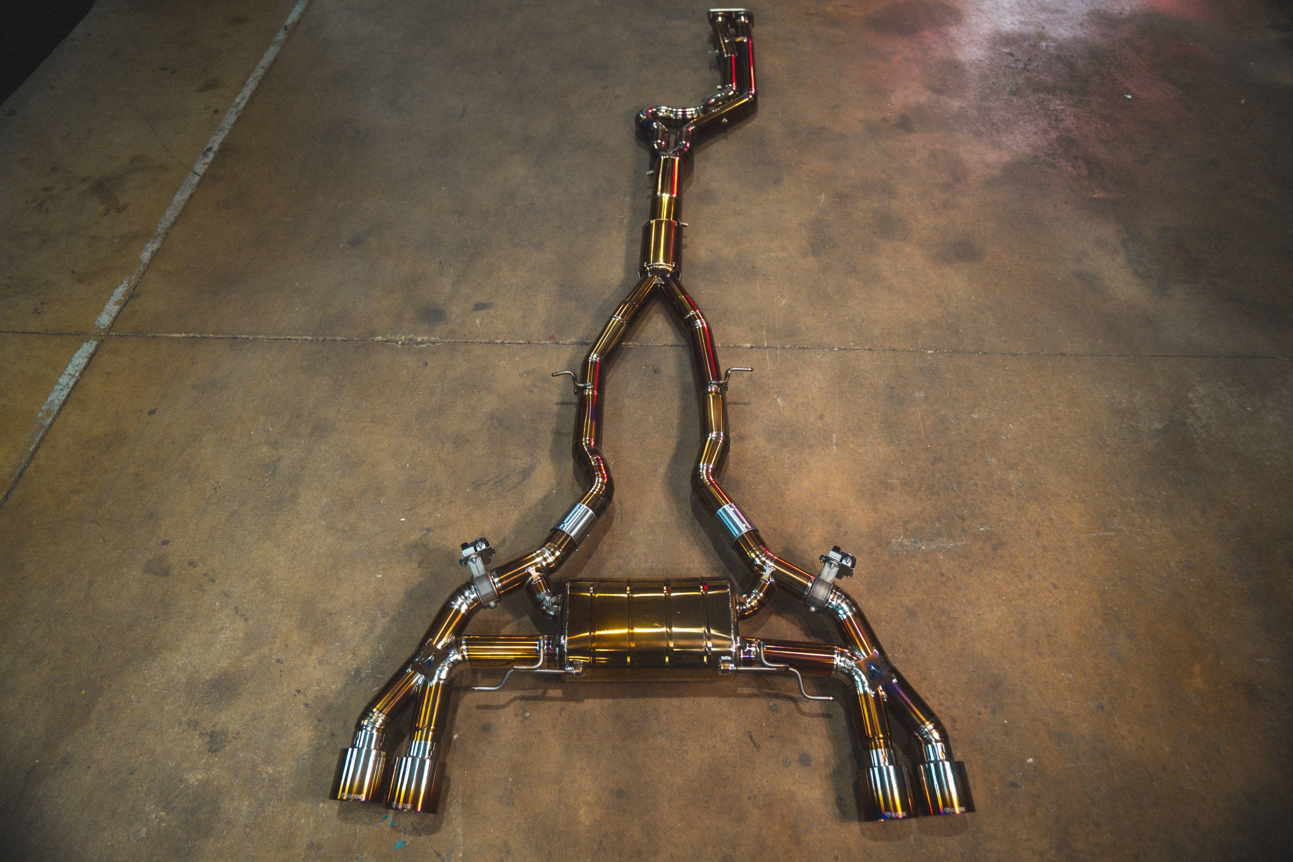 Kies-Motorsports Valvetronic Designs BMW X3M / X4M Valved Sport Exhaust System (F97 / F98) Equal length resonated design / Burnt Gold / Purple Titanium / (4) Brushed Steel (3.5 inch outlet) Main image